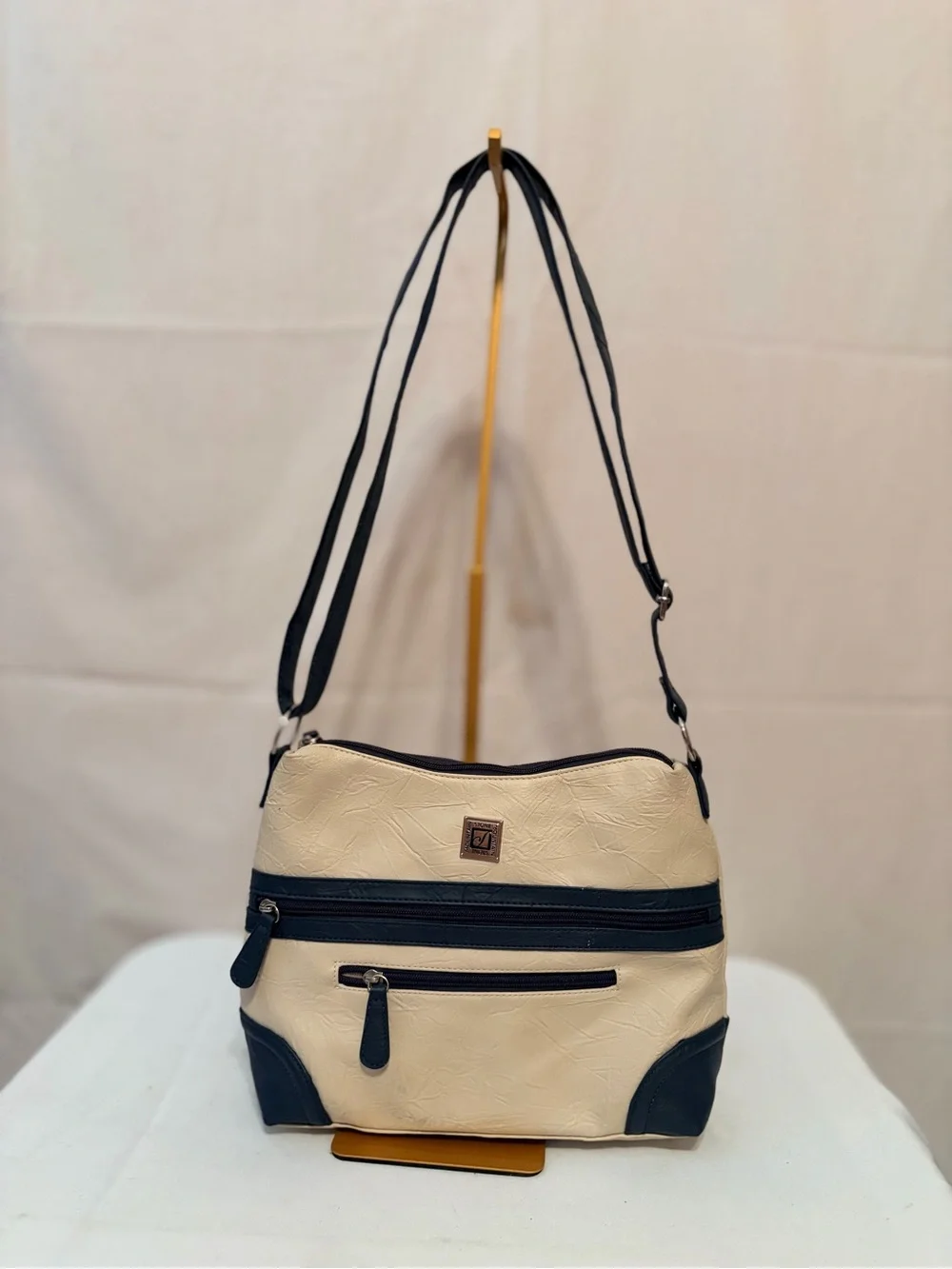 Stone Mountain cream and blue colorblock crossbody bag adjustable strap